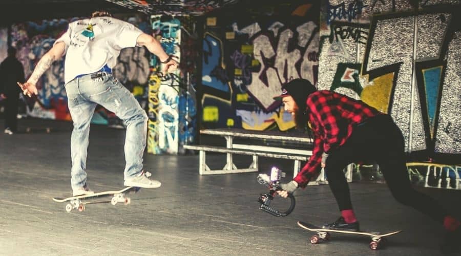 some dude recording his friend skateboarding