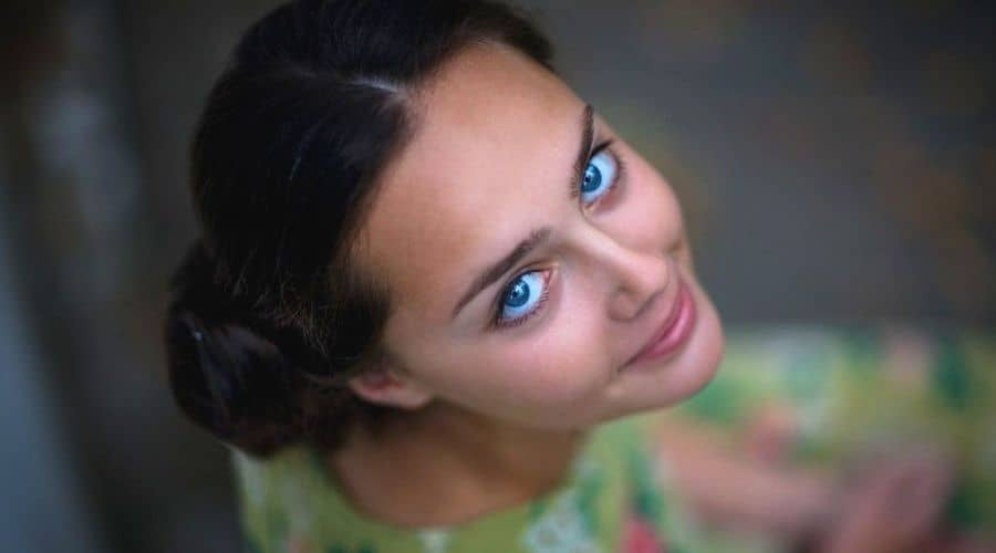 smiling girl looking on a camera - Shoot portrait photos in different angles