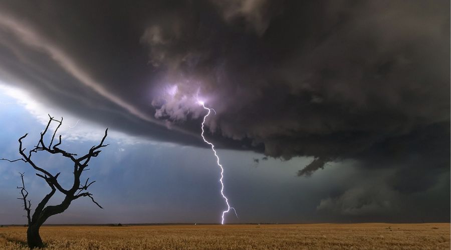 Lightning splitting the sky over a stark landscape