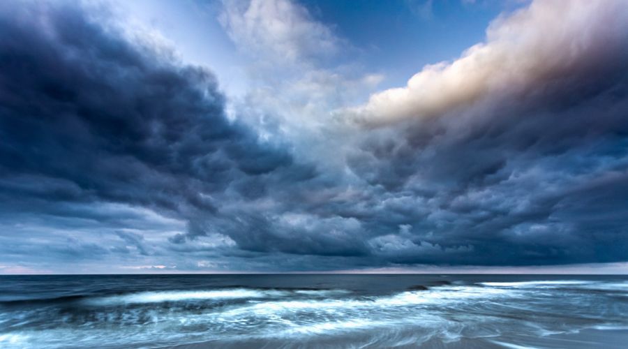 dramatic cloudy sky photo with foreground