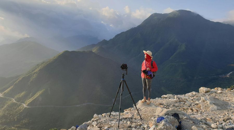 photographer out on a cloudy day with a tripod