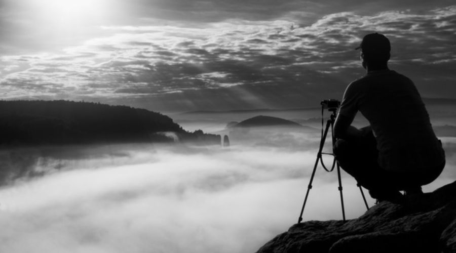 photographer sitting in fog